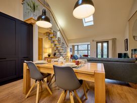 A dining room with a table and chairs at Riverside Park 5 in Keswick