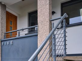 An entrance with a door and railing at Riverside Park 5 in Keswick