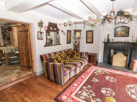 A living room with a sofa and fireplace at The Woodlands Lower Level Stepaside
