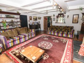 A living room with sofas and a table at The Woodlands Lower Level in Stepaside