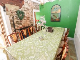 A dining room with a large table and chairs at The Woodlands Lower Level Stepaside