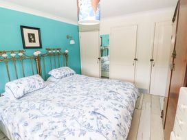 A bedroom with a bed and wardrobe at The Woodlands Lower Level in Stepaside