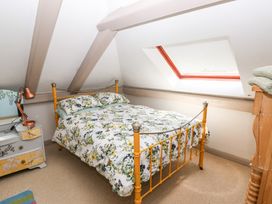 A bedroom with a bed and desk at The Woodlands Lower Level Stepaside