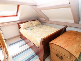 A bedroom with a bed and a chest of drawers at The Woodlands Lower Level Stepaside