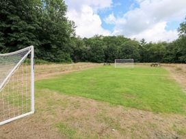 A soccer field with goals and picnic tables at The Woodlands Lower Level Stepaside