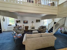 A living room with sofas and a fireplace at Bethel Chapel in Staithes