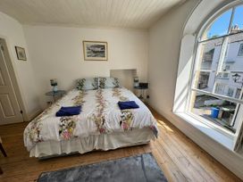 A bedroom with a bed and window at Bethel Chapel in Staithes