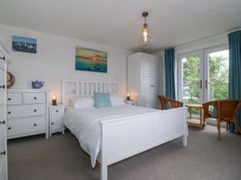 A bedroom with a bed and drawer at Bryn Awel in Mynytho near Abersoch