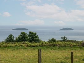 A view of two islands across the sea at Bryn Awel in Mynytho near Abersoch