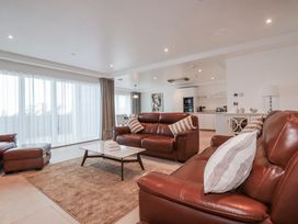 A living room with a sofa and coffee table at 13 Cliff Edge in Newquay