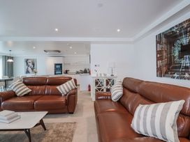 A living room with sofas and a coffee table at 13 Cliff Edge, Newquay