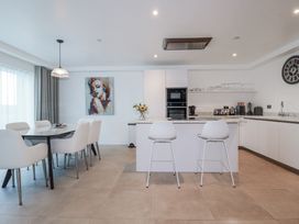A kitchen with a dining area and an island at 13 Cliff Edge Newquay