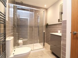 A bathroom with a shower and toilet at Ash Cottage in Combe Martin