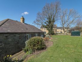 An outdoor view of a house with garden at Whinney Moor in 