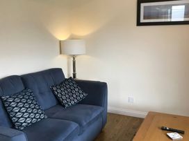 A living room with a sofa and lamp at Bugle Saltburn-By-The-Sea