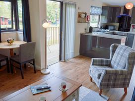 A living room with a table and chairs at Bugle, Saltburn-By-The-Sea