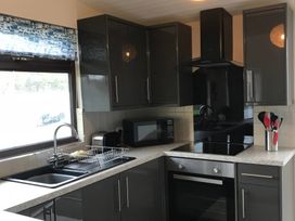 A kitchen with cabinets and appliances at Bugle in Saltburn-By-The-Sea