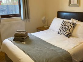 A bedroom with a bed and towels at Bugle Saltburn-By-The-Sea