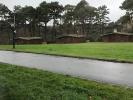 An outdoor area with cabins and trees at Bugle Saltburn-By-The-Sea