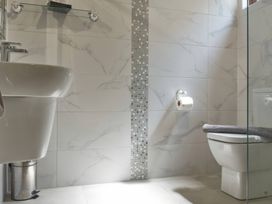 A bathroom with sink and toilet at Lavender Lodge in Saltburn-By-The-Sea