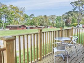 An outdoor area with a table and chairs at Lavender Lodge in Saltburn-By-The-Sea