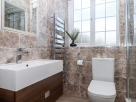 A bathroom with a sink and toilet at Kinbrae Apartment in Torquay