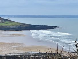 A beach with waves and cliffs at Hazel Barn North Molton