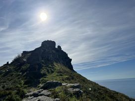 A rock formation on a hill overlooking the ocean at Oak Cottage in North Molton