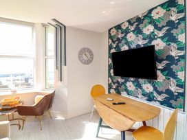 A dining room with a table and chairs at Apt 4 @ Hunter's Quay in Bridlington