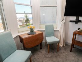 A seating area with chairs and a table at Heron in St Ives