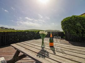 A table with flowers and champagne at Eddystone in Hope Cove