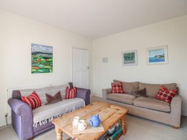 A living room with sofas and a coffee table at Eddystone in Hope Cove