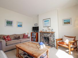 A living room with a sofa and coffee table at Eddystone in Hope Cove