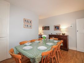 A dining room with a table set for dinner at Eddystone in Hope Cove