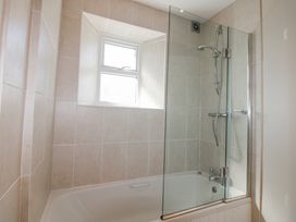 A bathroom with a bathtub and shower at Eddystone in Hope Cove
