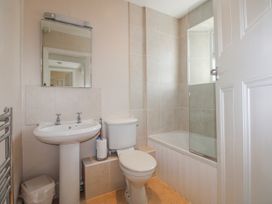 A bathroom with a sink, toilet, and bathtub at Eddystone in Hope Cove
