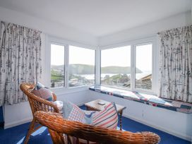 A snug with windows overlooking the landscape at Eddystone in Hope Cove