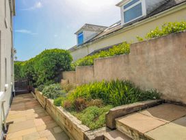 A garden with stone steps and plants at Eddystone Hope Cove