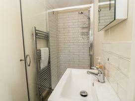 A bathroom with a shower and sink at White Stones, Fulbrook, near Burford