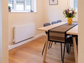 A dining room with a table and chairs at White Stones, Fulbrook, near Burford