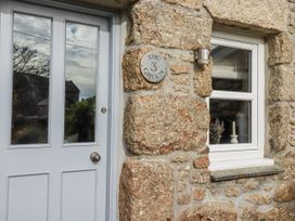 An entrance with a door and window at 3 The Green