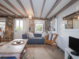 A living room with a sofa and coffee table at 3 The Green