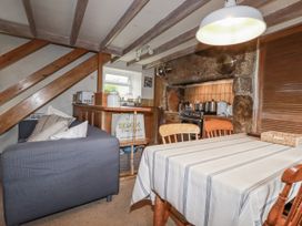 A dining room with a table and chairs at 3 The Green 