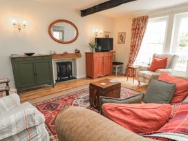 A living room with a sofa and coffee table at 4 Duck Street in Dorchester