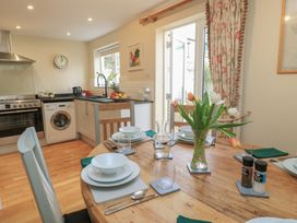 A kitchen with table set for dining at 4 Duck Street Dorchester