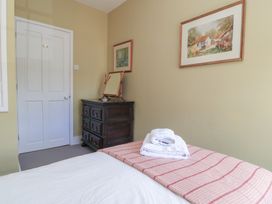 A bedroom with a bed and chest of drawers at 4 Duck Street Dorchester