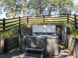 An outdoor area with a hot tub and steps at Oak Tree View Nantmel near Rhayader