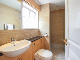 A bathroom with a sink and toilet at Home in Salcombe