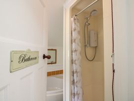 A bathroom with a shower and a bathtub at Home in Salcombe