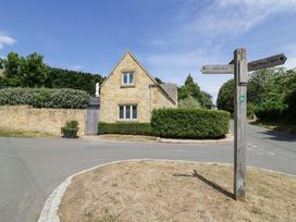 A house with a signpost at Wyncliffe in Chipping Campden